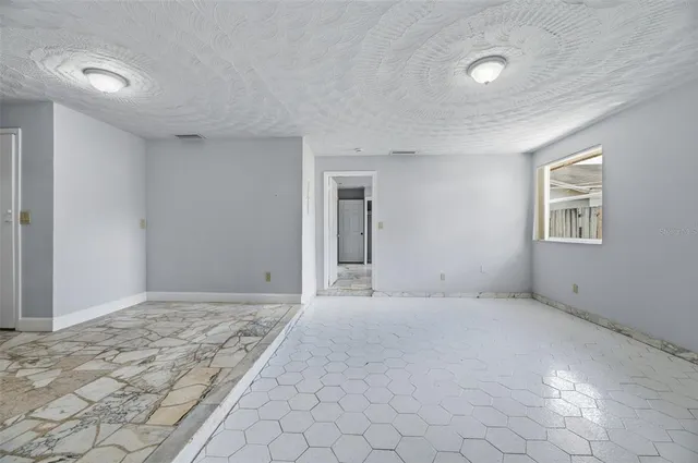 a view of an empty room and window