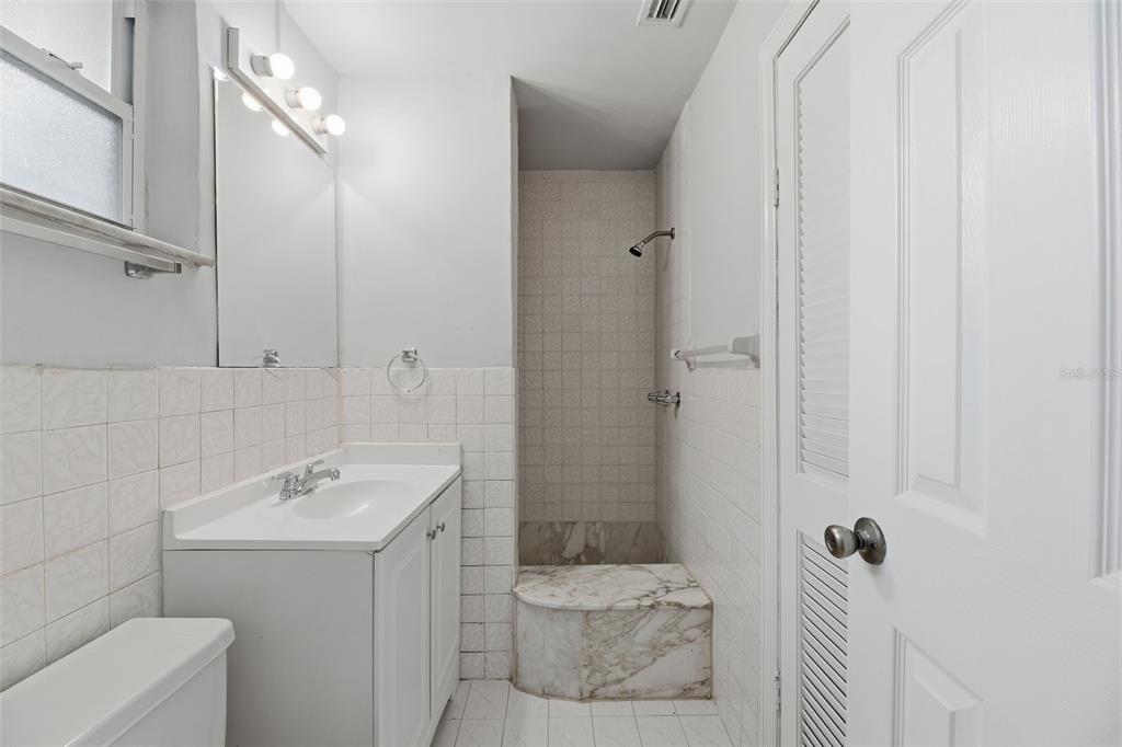 5735 Hayes Street Hollywood, FL 33021 - Photo 26 of 40 a bathroom with a sink a toilet and shower