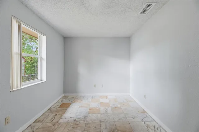 a view of a room that has a window in it