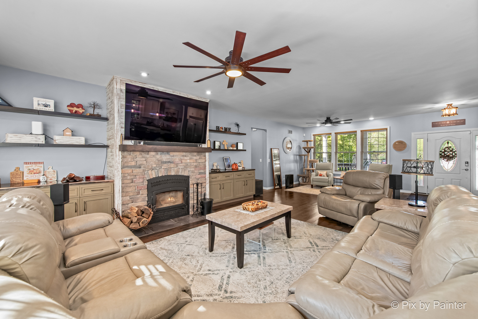 39247 Rangers Way Antioch, IL 60002 - Photo 21 of 53 a living room with furniture a flat screen tv and a fireplace