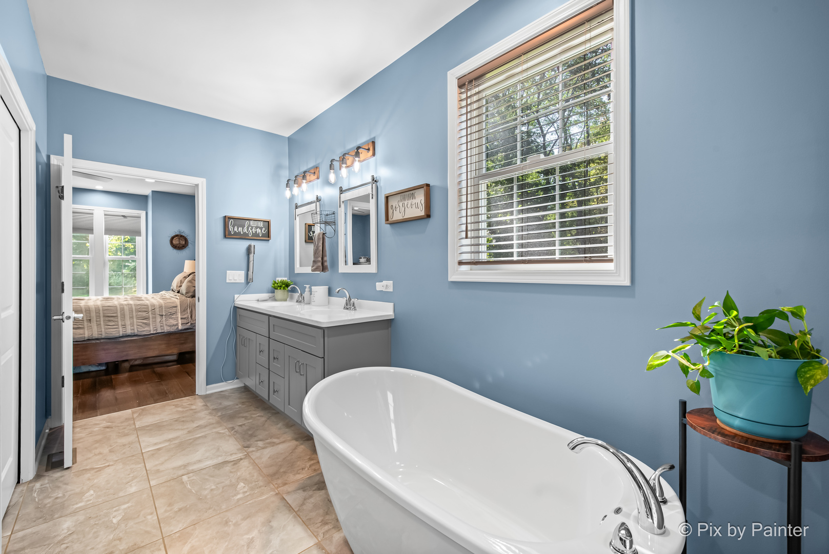 39247 Rangers Way Antioch, IL 60002 - Photo 27 of 53 a bathroom with a tub sink and mirror