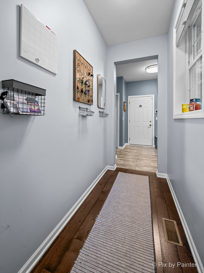 39247 Rangers Way Antioch, IL 60002 - Photo 31 of 53 a view of a hallway with wooden floor