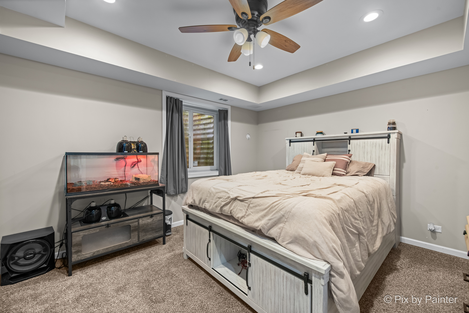 39247 Rangers Way Antioch, IL 60002 - Photo 46 of 53 a bedroom with a bed and a chandelier