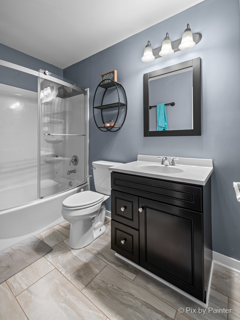 39247 Rangers Way Antioch, IL 60002 - Photo 47 of 53 a bathroom with a toilet sink and mirror