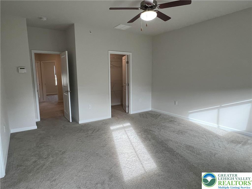 2356 Raya Way Easton, PA 18045 - Photo 11 of 28 Soft carpeting pairs with neutral walls in this comfortable bedroom featuring a walk-in closet.