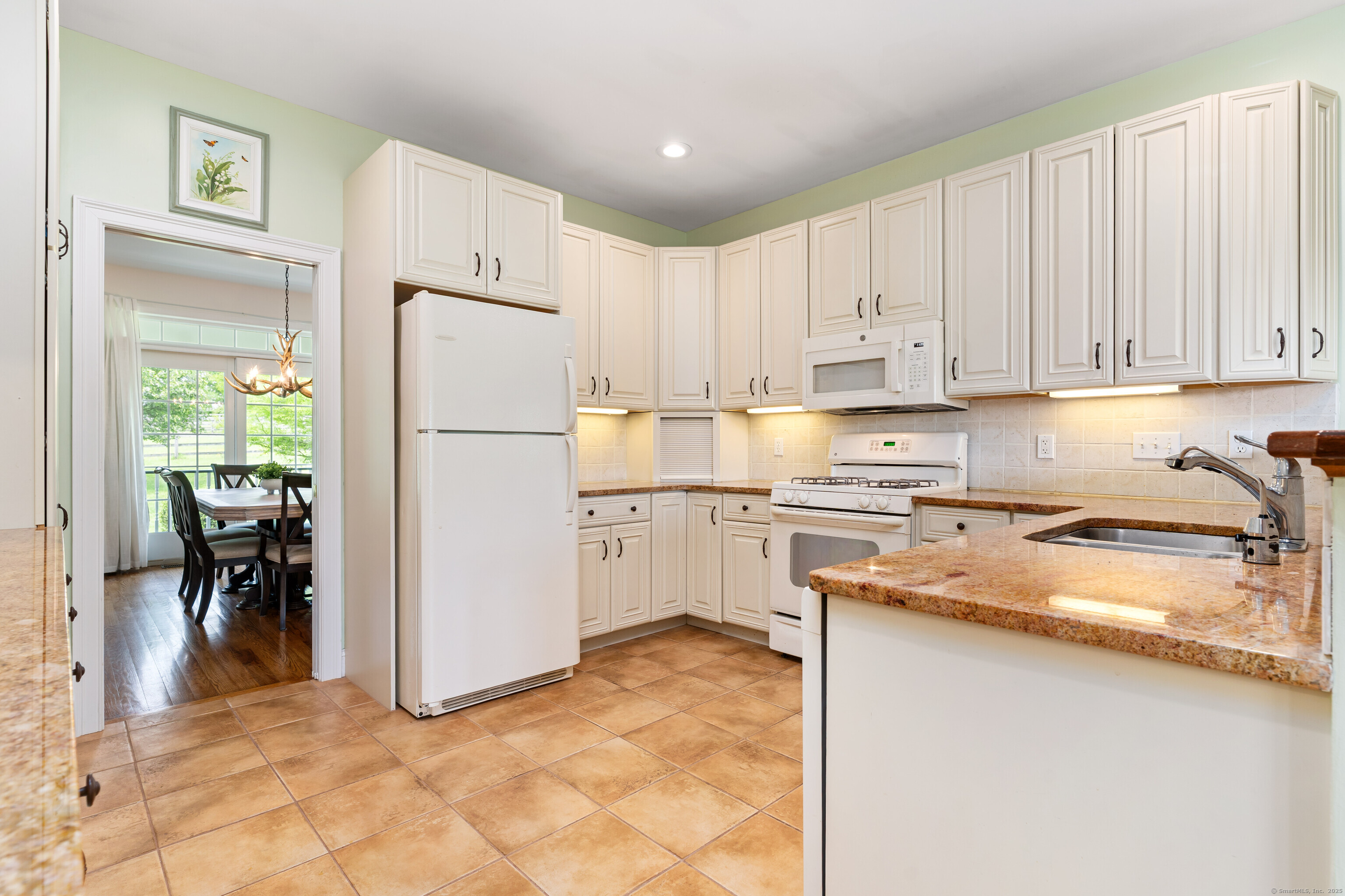 66-86 Bebbington Road Ashford, CT 06278 - Photo 12 of 39 a kitchen with granite countertop a refrigerator sink and cabinets