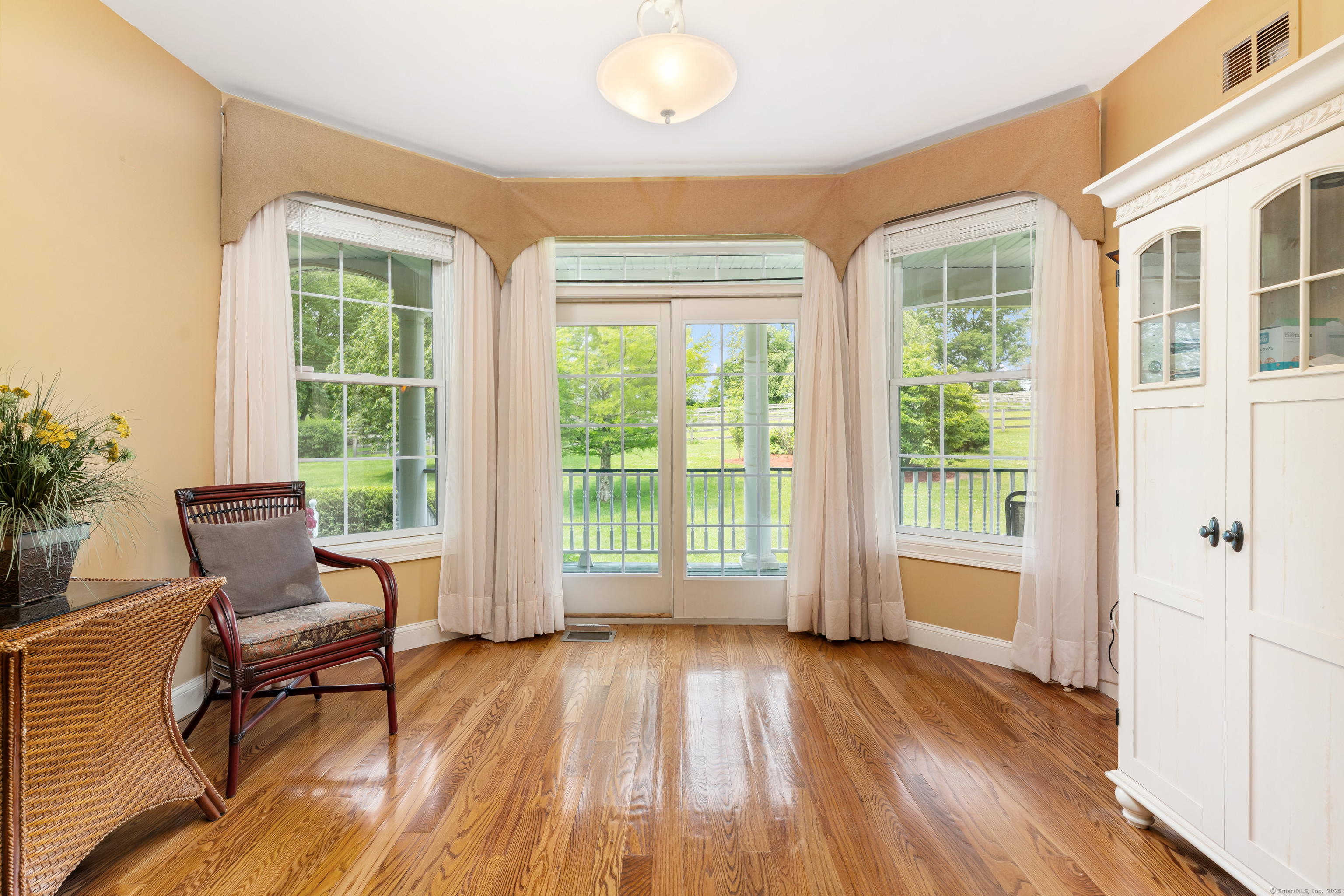 66-86 Bebbington Road Ashford, CT 06278 - Photo 13 of 39 a view of a livingroom with wooden floor and furniture