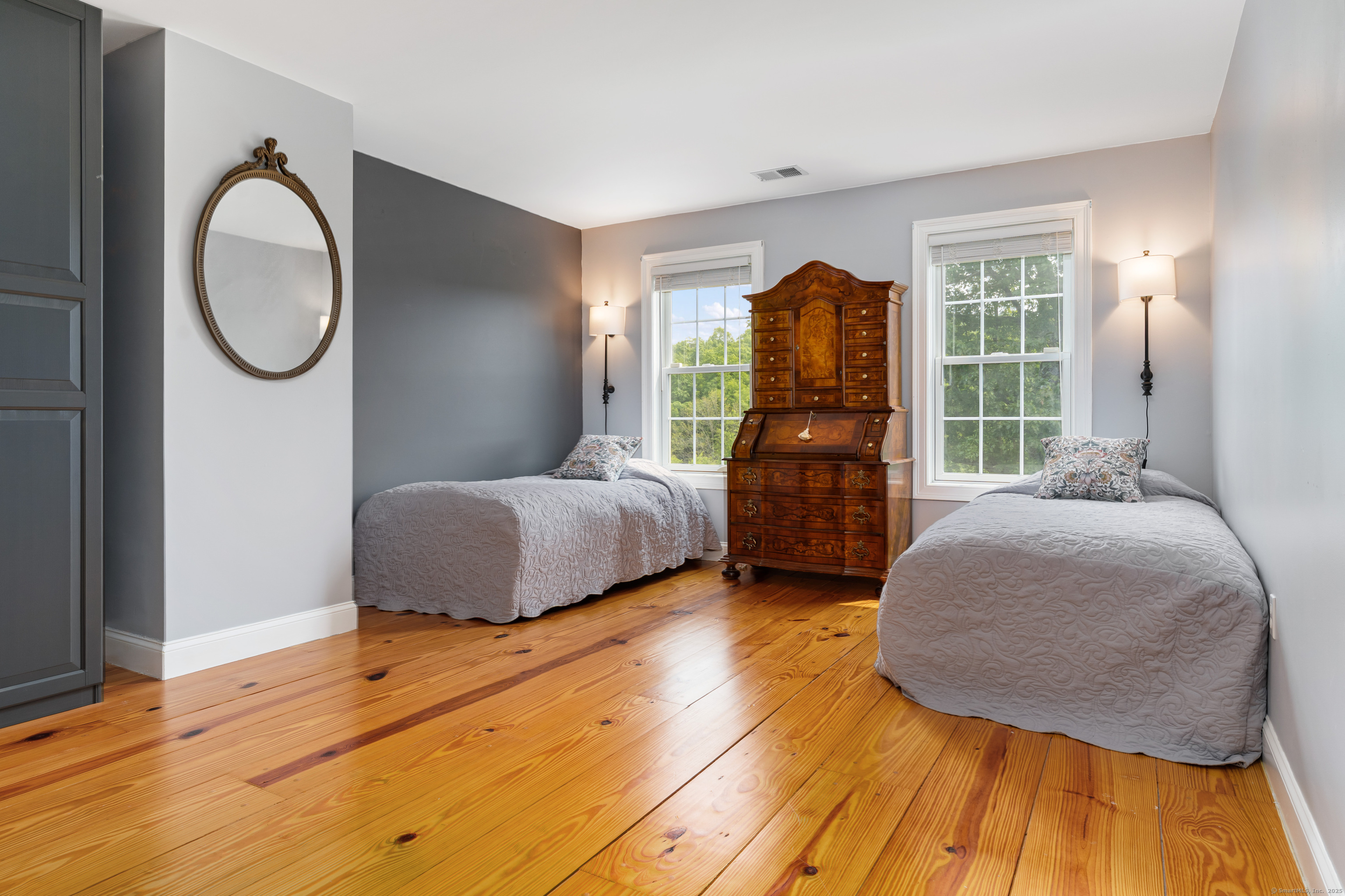 66-86 Bebbington Road Ashford, CT 06278 - Photo 16 of 39 a bedroom with a bed a dresser and window