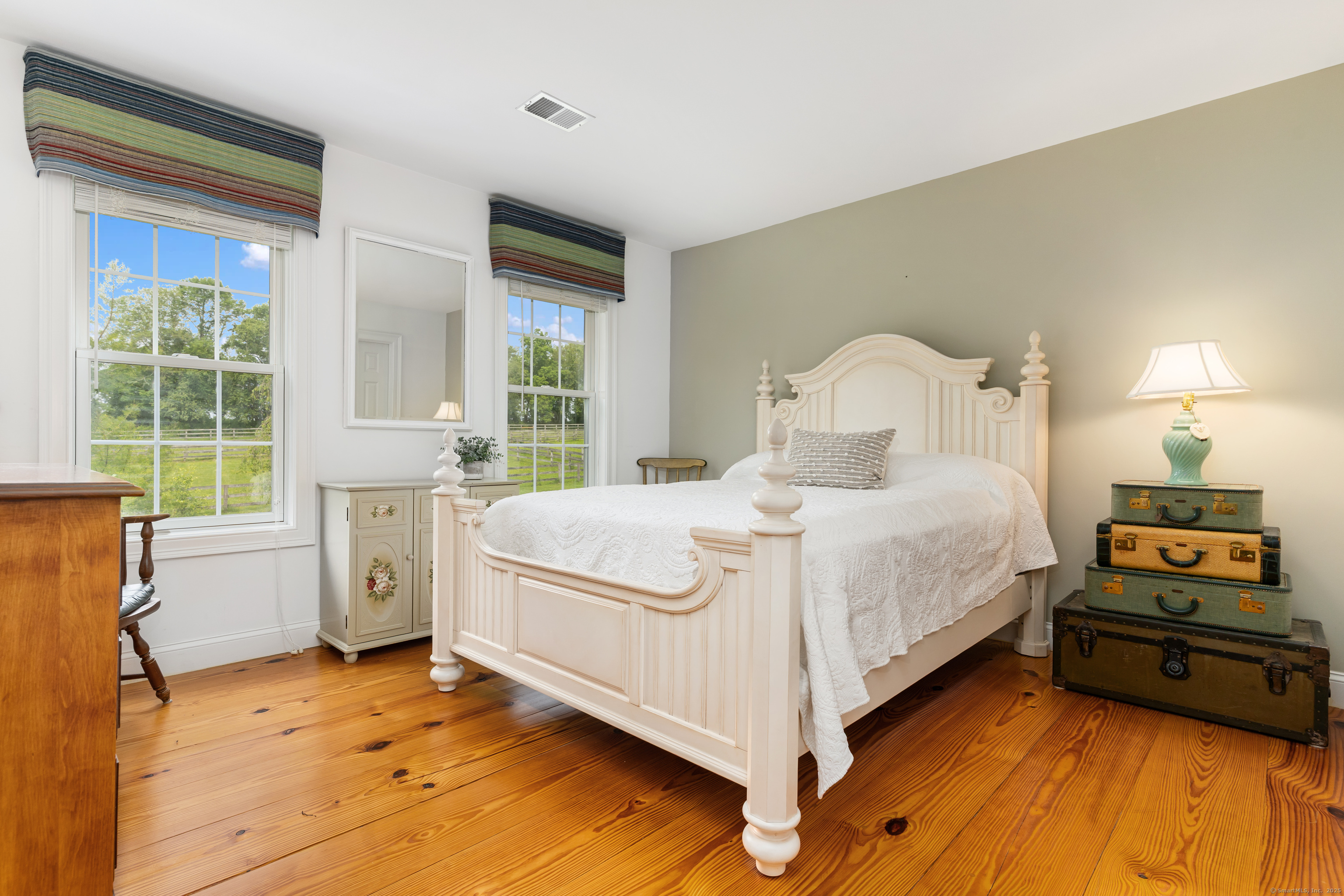 66-86 Bebbington Road Ashford, CT 06278 - Photo 17 of 39 a bedroom with a bed and a large window