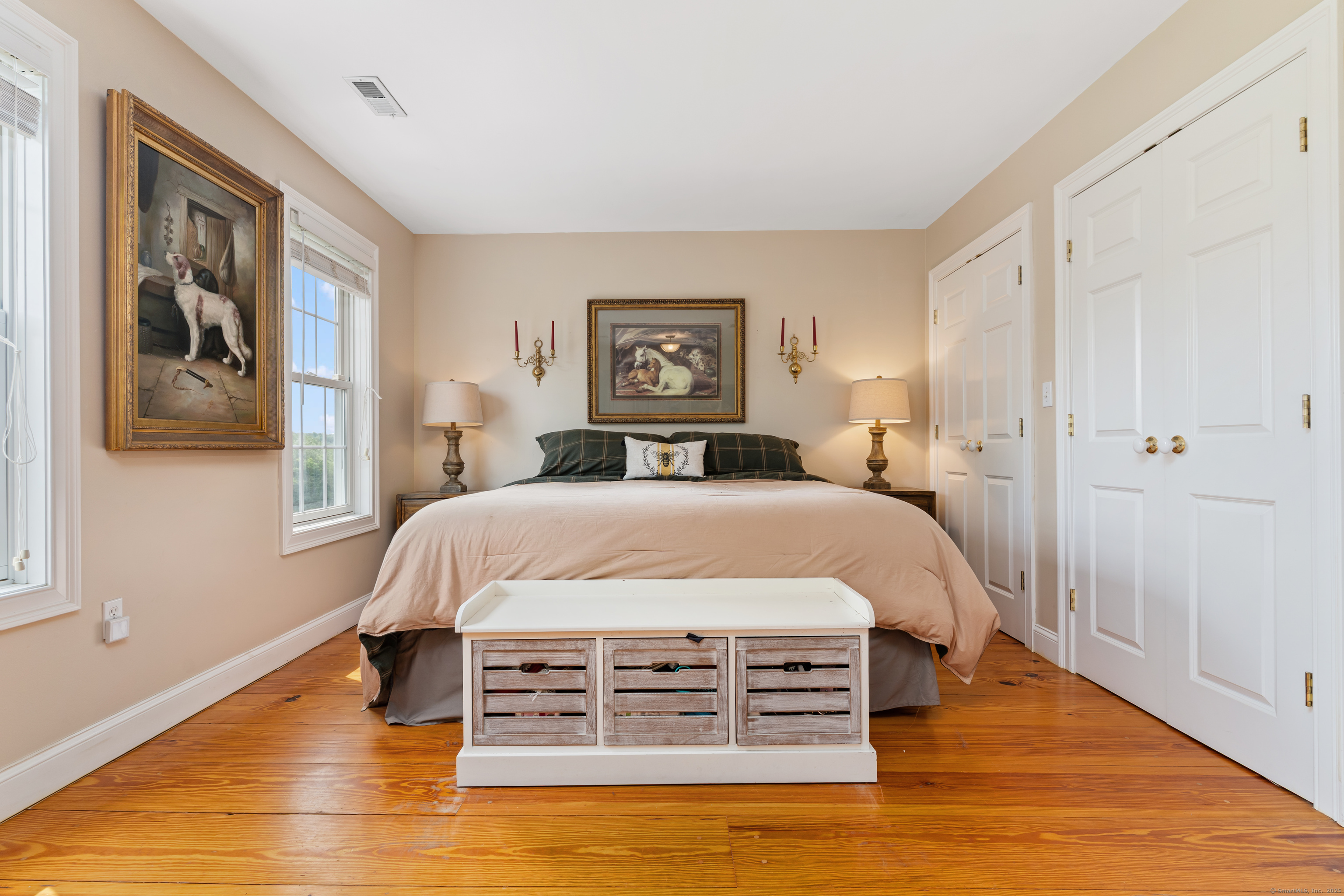 66-86 Bebbington Road Ashford, CT 06278 - Photo 22 of 39 a bed room with a bed and a painting on the wall