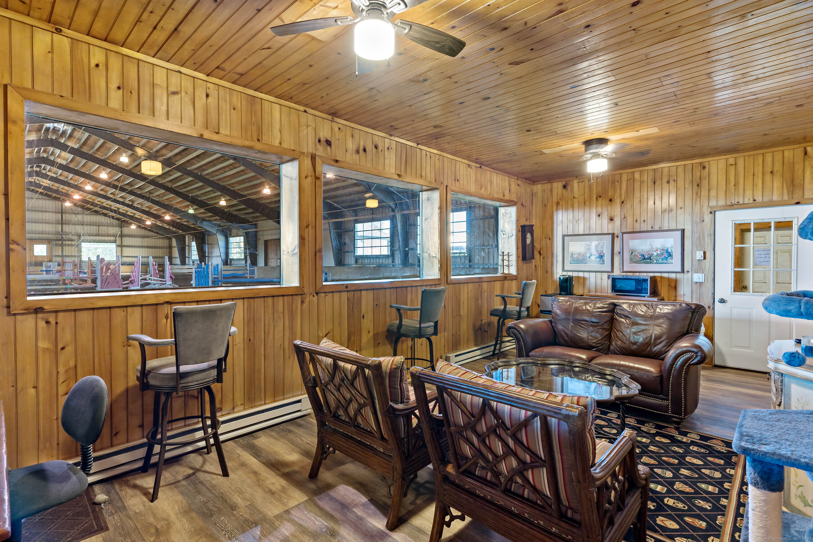 66-86 Bebbington Road Ashford, CT 06278 - Photo 33 of 39 a living room with furniture a window and gym equipment