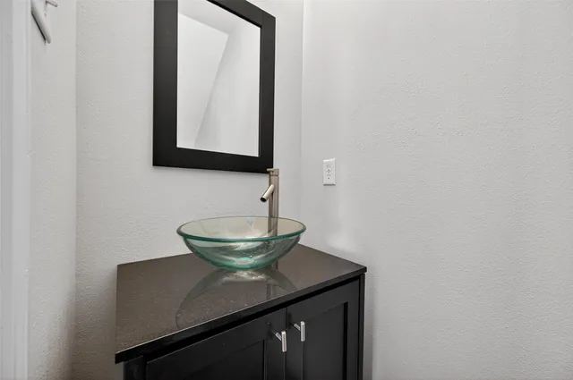 a view of a hallway with paintings on the wall