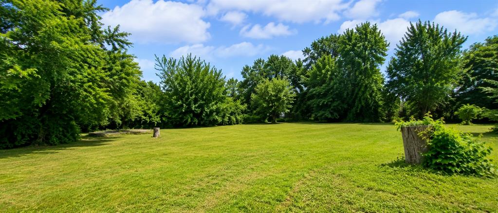 504 North Hampton Road DeSoto, TX 75115 - Photo 11 of 11 Expansive green lawn with mature trees bordering the perimeter