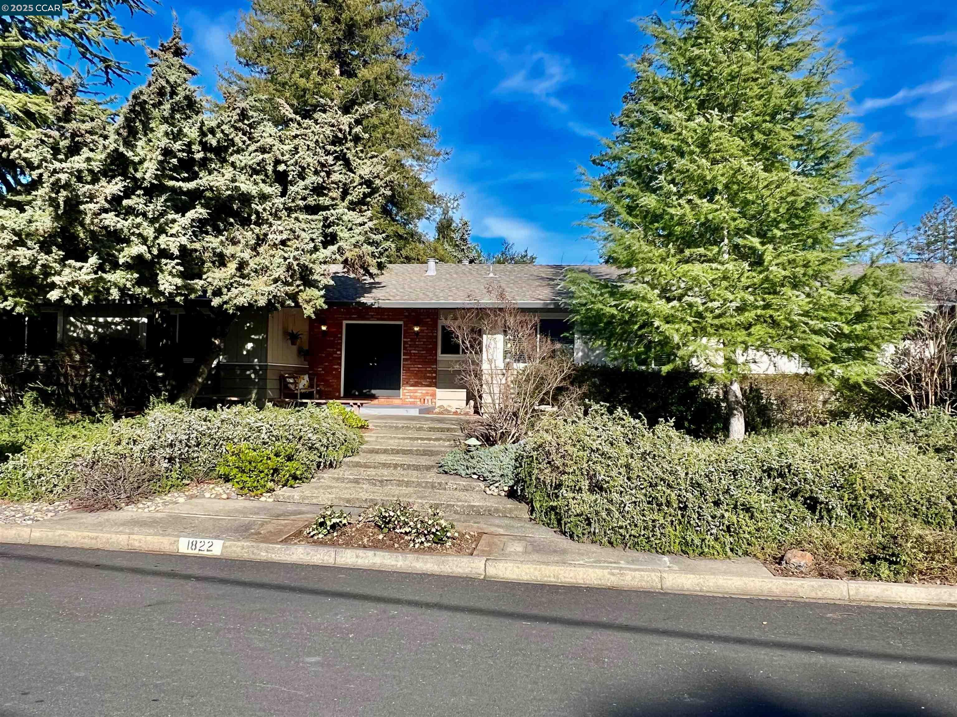 1822 Del Rio Drive Lafayette, CA 94549 - Photo 1 of 1 front view of a house with a yard