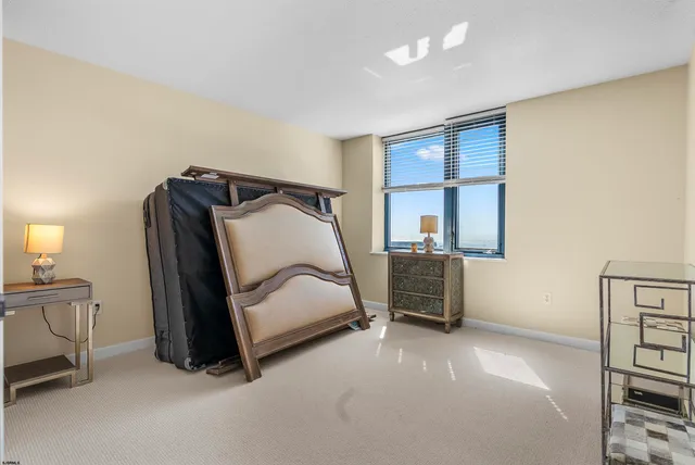 a bedroom with a bed and dresser