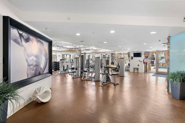 a lobby with furniture and stairs