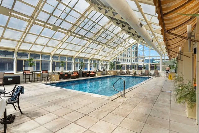 a view of a swimming pool with seating area