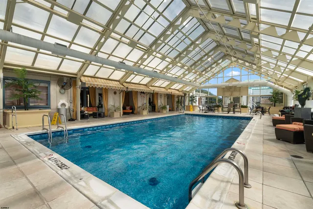 a view of swimming pool with outdoor seating