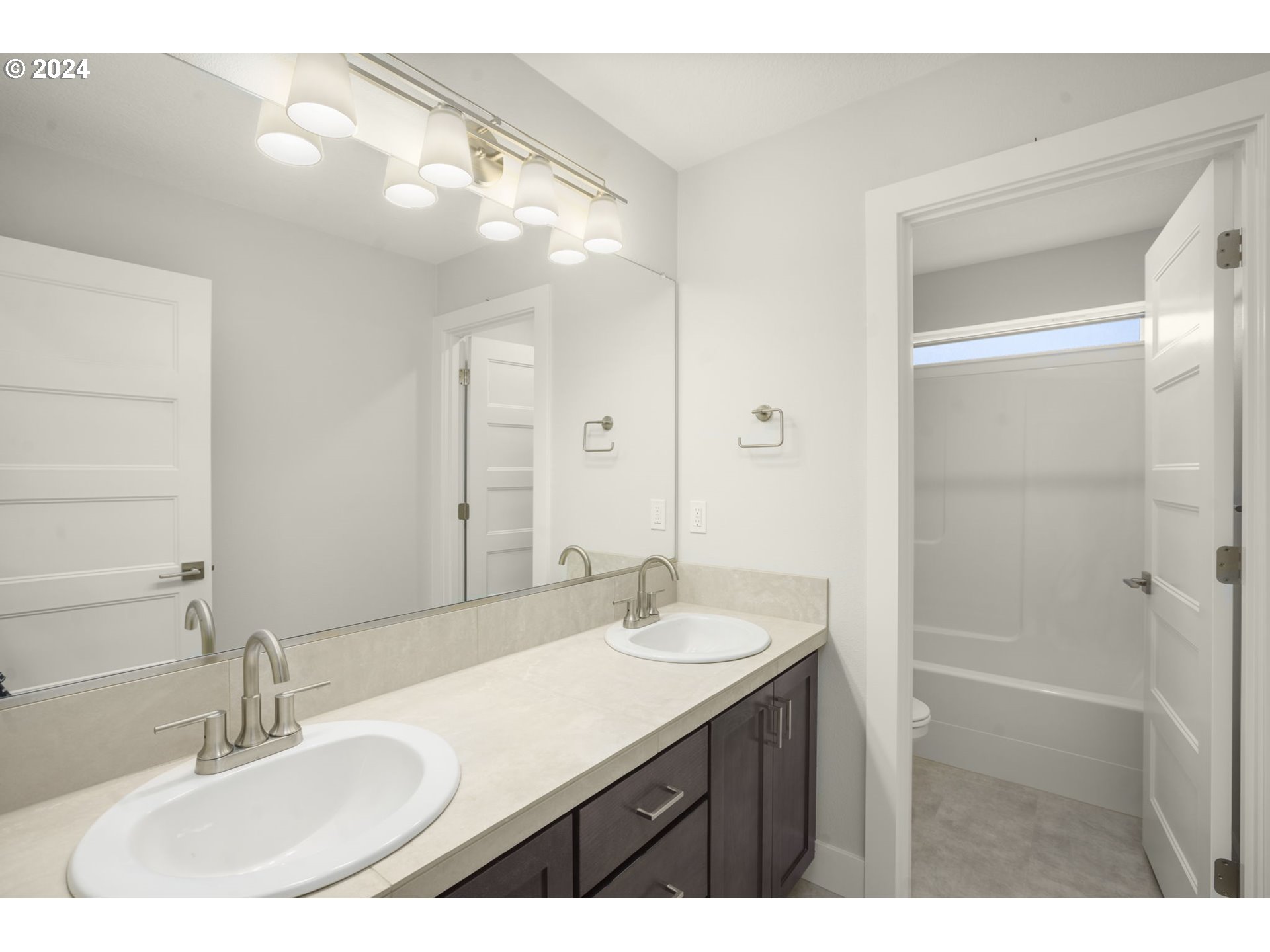 7233 Northeast Ridge Drive Hillsboro, OR 97124 - Photo 17 of 24 a bathroom with a sink double vanity and a mirror