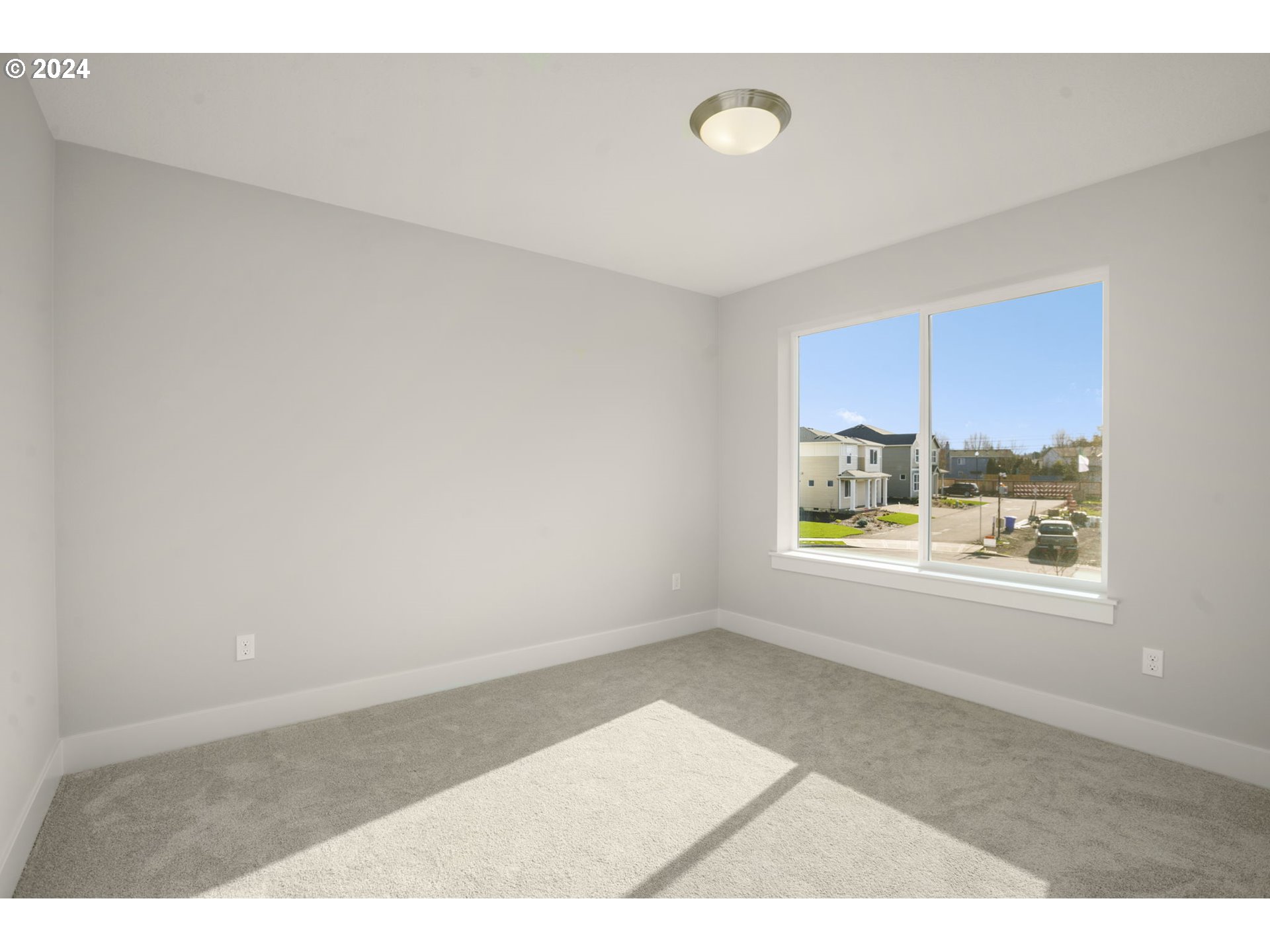 7233 Northeast Ridge Drive Hillsboro, OR 97124 - Photo 18 of 24 a view of an empty room with a window