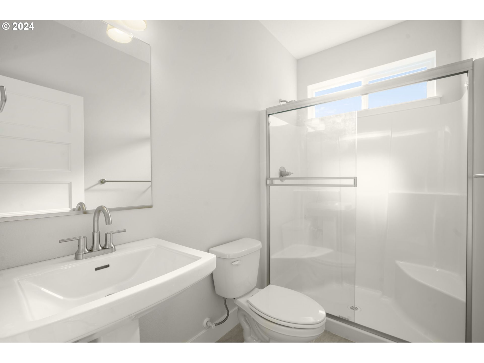7233 Northeast Ridge Drive Hillsboro, OR 97124 - Photo 19 of 24 a bathroom with a sink toilet and shower