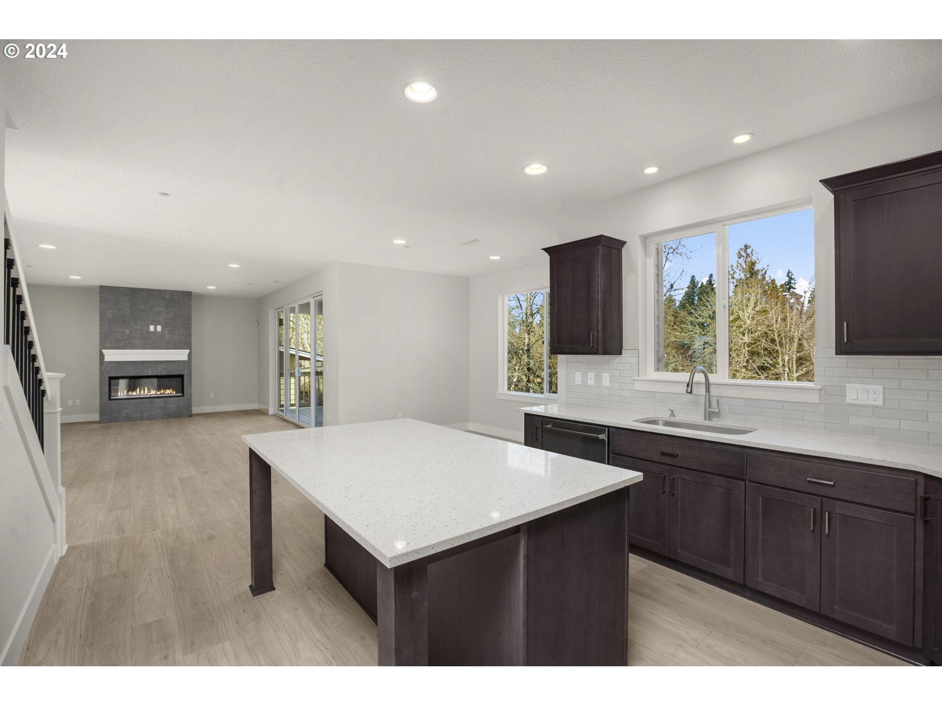 7233 Northeast Ridge Drive Hillsboro, OR 97124 - Photo 4 of 24 a kitchen with stainless steel appliances a sink and a refrigerator