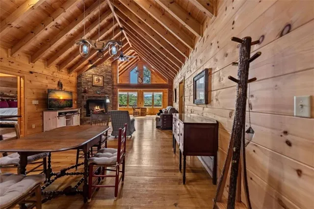a dining room with furniture and wooden floor