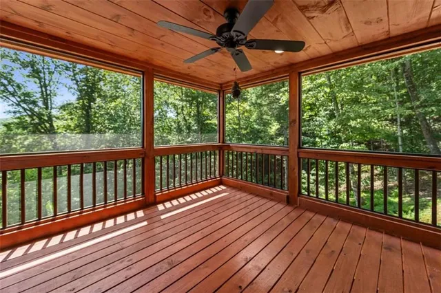 a view of backyard with outdoor seating and green space