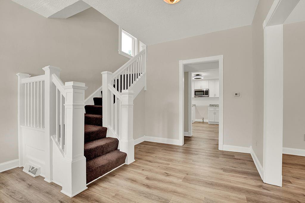 62 1st Street Irwin, PA 15642 - Photo 12 of 27 a view of entryway and hall with wooden floor