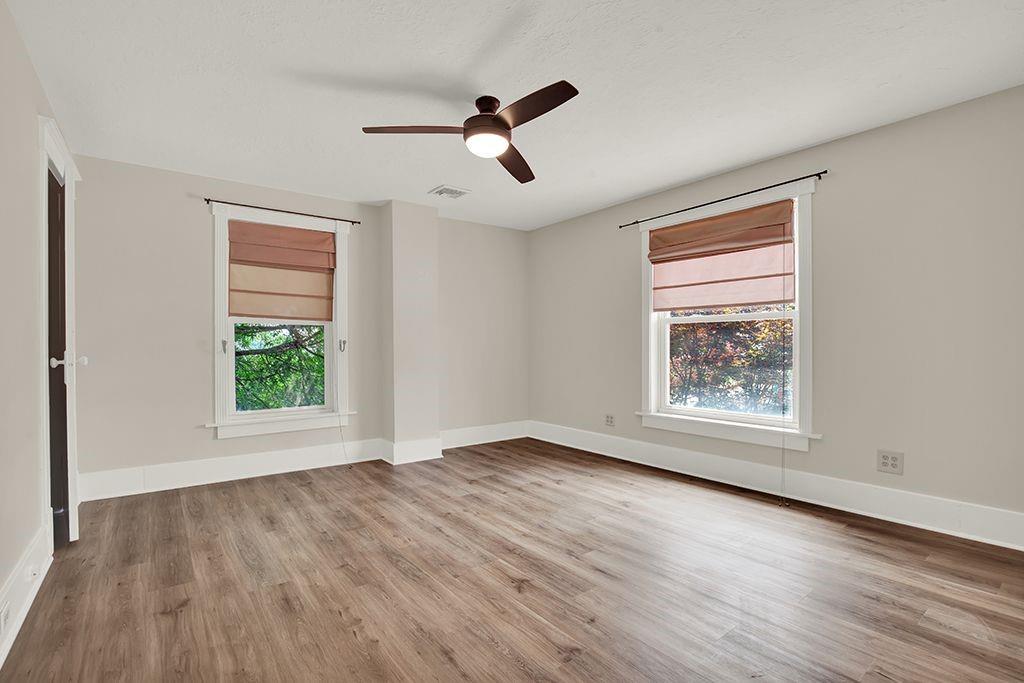 62 1st Street Irwin, PA 15642 - Photo 18 of 27 a view of an empty room with wooden floor and a window