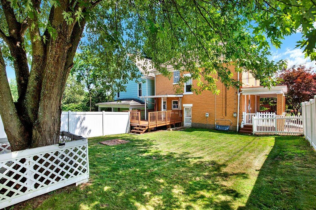 62 1st Street Irwin, PA 15642 - Photo 24 of 27 a view of a house with backyard and a tree