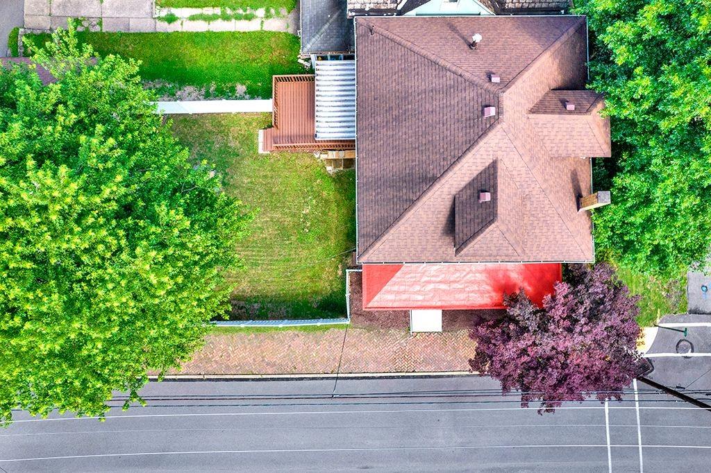 62 1st Street Irwin, PA 15642 - Photo 25 of 27 an aerial view of a house with a yard and a garage