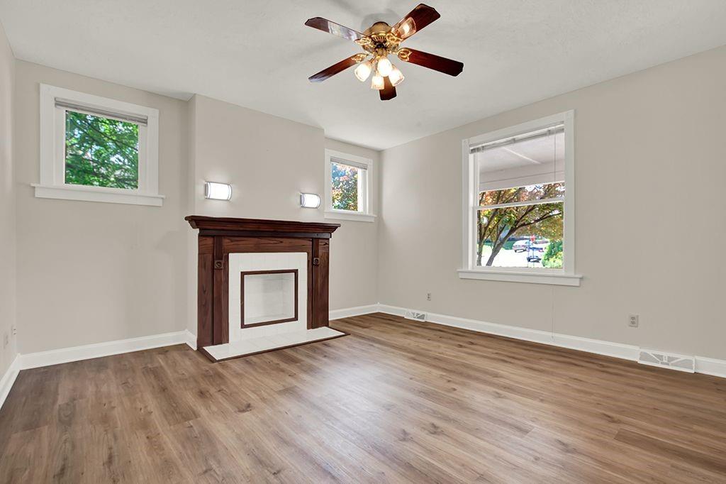 62 1st Street Irwin, PA 15642 - Photo 5 of 27 a view of an empty room with window and wooden floor