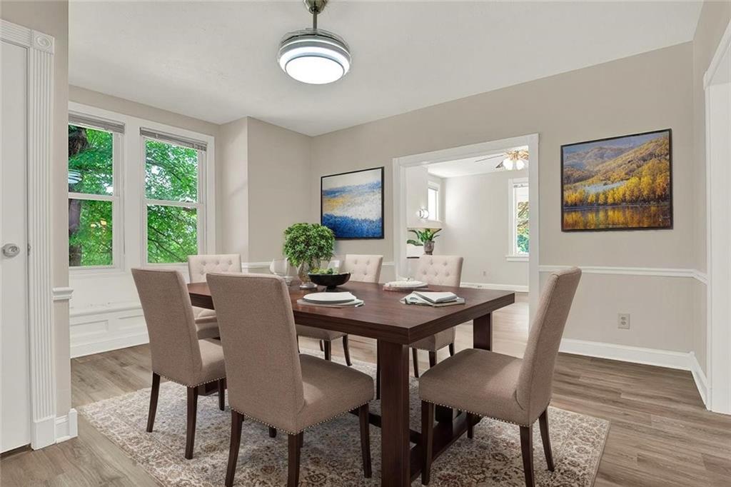 62 1st Street Irwin, PA 15642 - Photo 7 of 27 a view of a dining room with furniture window and wooden floor