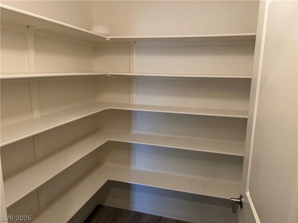9581 Aberdeen Ridge Court Las Vegas, NV 89148 - Photo 19 of 25 Ample wrap-around shelving offers generous storage in this functional pantry.