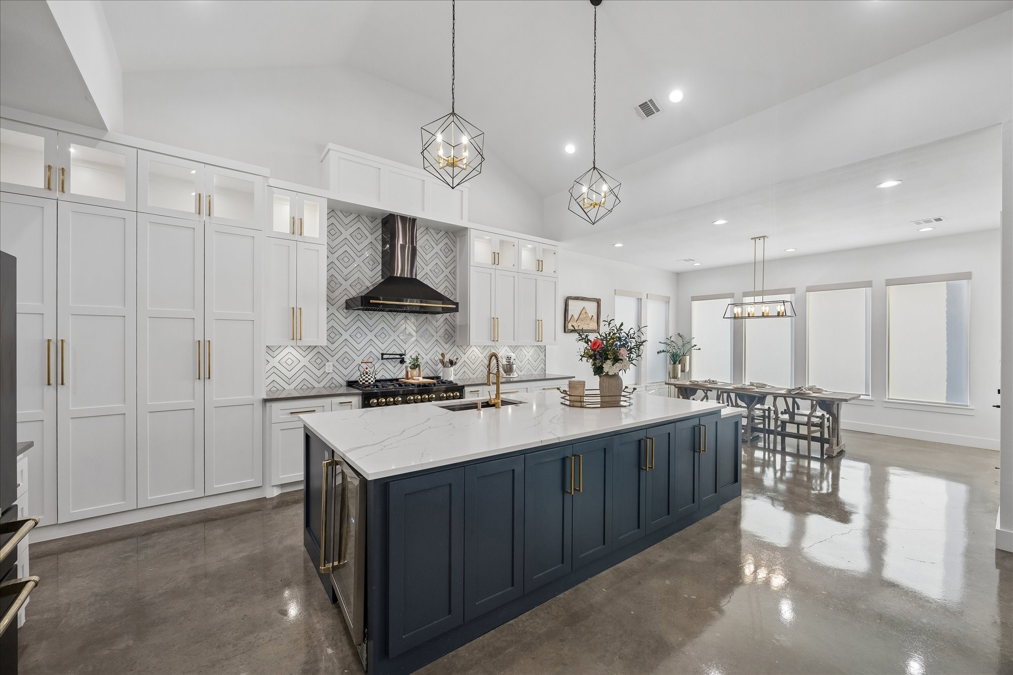 3555 Eli Road Bellville, TX 77418 - Photo 6 of 31 Thoughtfully designed custom cabinetry provides plenty of storage, with a hidden butler’s pantry tucked behind the cabinets for added functionality and convenience.