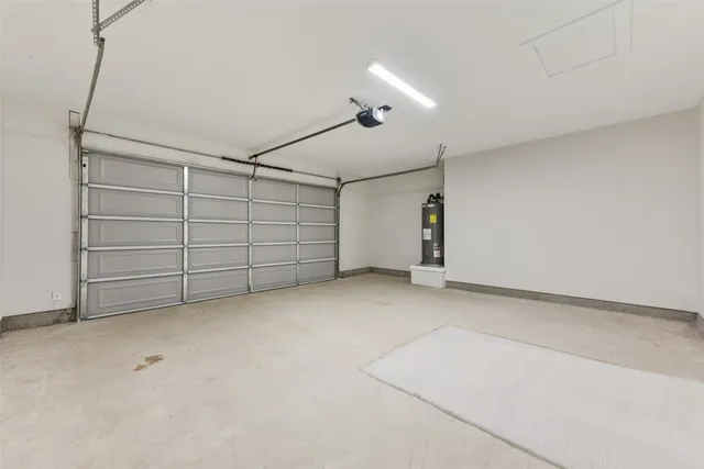 an empty room with wooden floor and cabinet