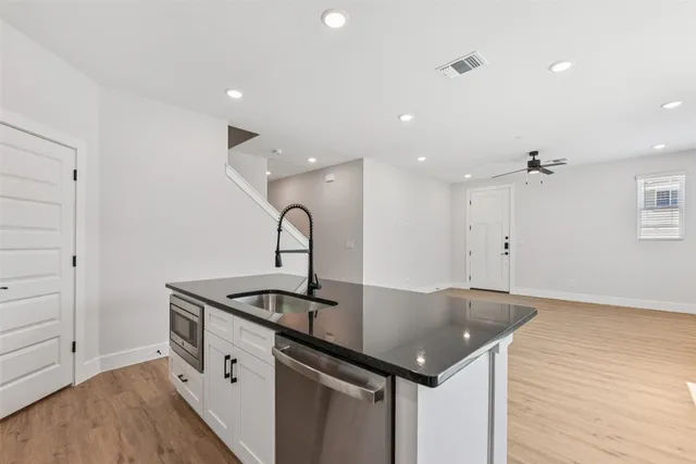 a view of outdoor kitchen and sink