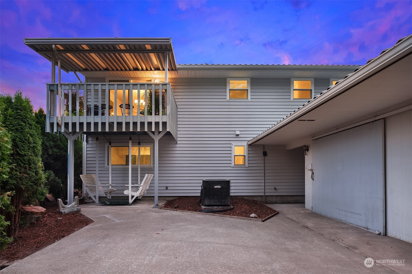 1005 Ave A Snohomish, WA 98290 - Photo 19 of 27 a backyard of a house with barbeque oven and a table and chairs