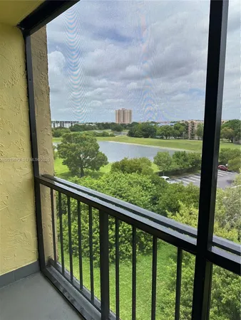 a view of balcony with yard