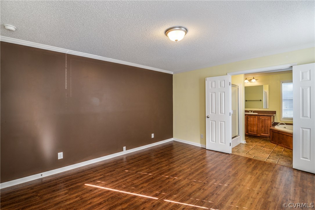 12816 Cox Road Church Road, VA 23833 - Photo 15 of 42 a view of a room with wooden floor and a bathroom