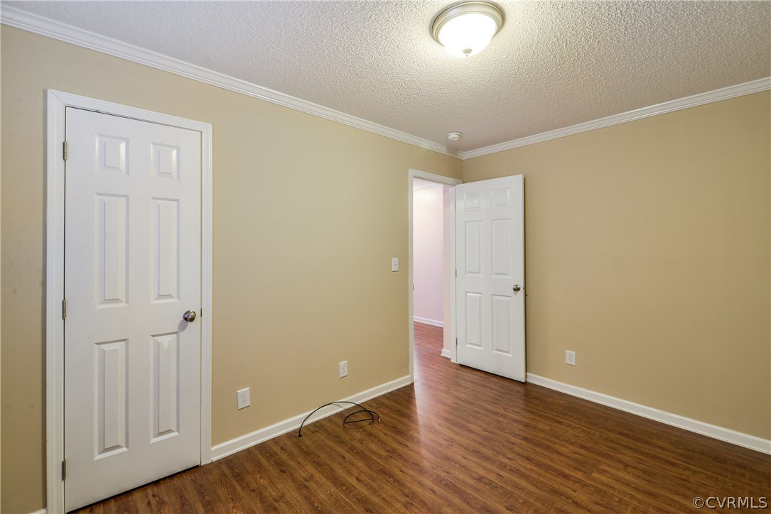12816 Cox Road Church Road, VA 23833 - Photo 19 of 42 a view of an empty room with wooden floor