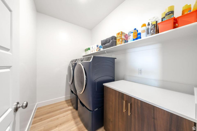 5963 Flattop Drive St. George, UT 84790 - Photo 18 of 45 Laundry area featuring wood-finish flooring and a white paneled door
