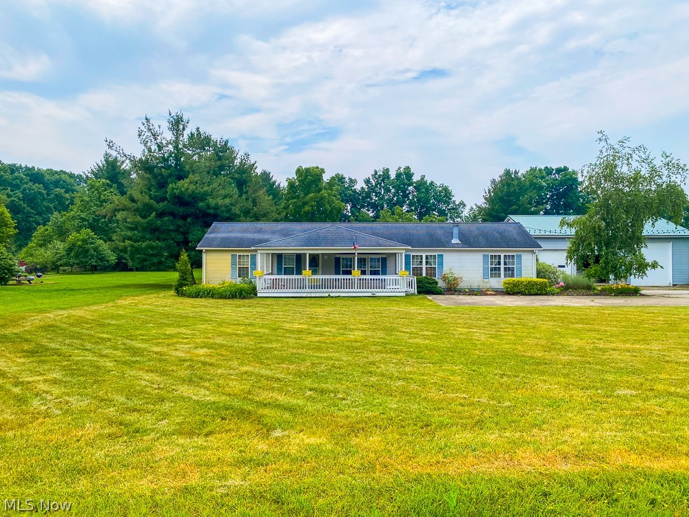 17499 Kinsman Road Middlefield, OH 44062 - Photo 1 of 49 Ranch-style home with a garage and a front lawn