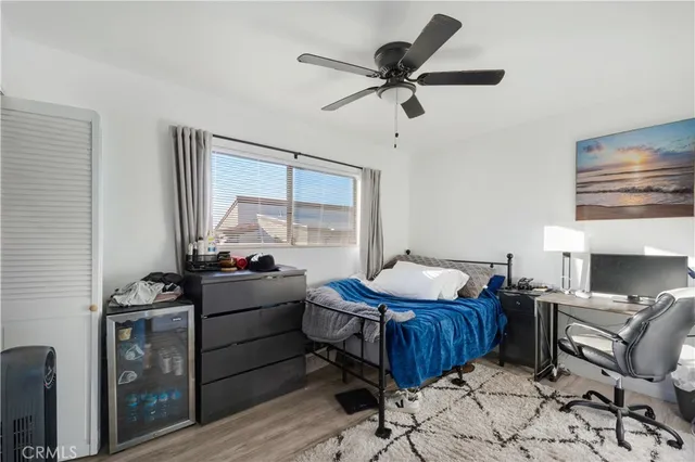 a bedroom with furniture and a window