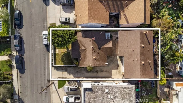 a kitchen with stainless steel appliances kitchen island granite countertop a stove a sink dishwasher and a refrigerator with wooden floor