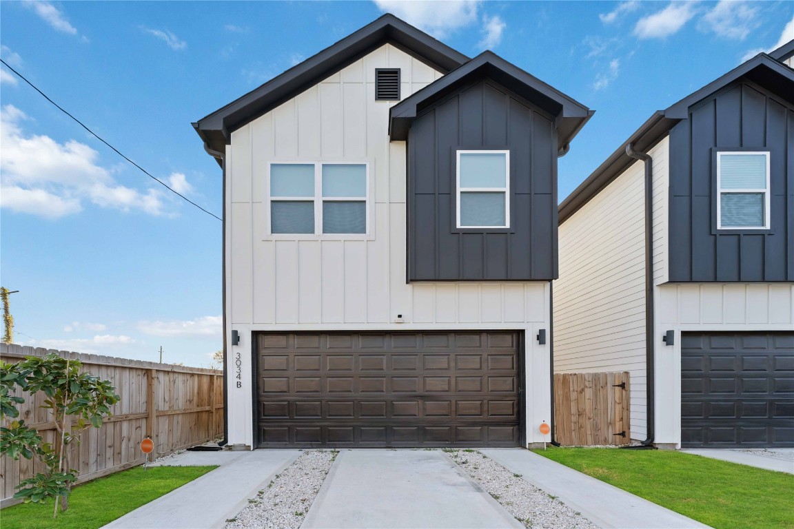 3034 Gray Street, Unit B Houston, TX 77004 - Photo 1 of 23 a front view of a house with a yard