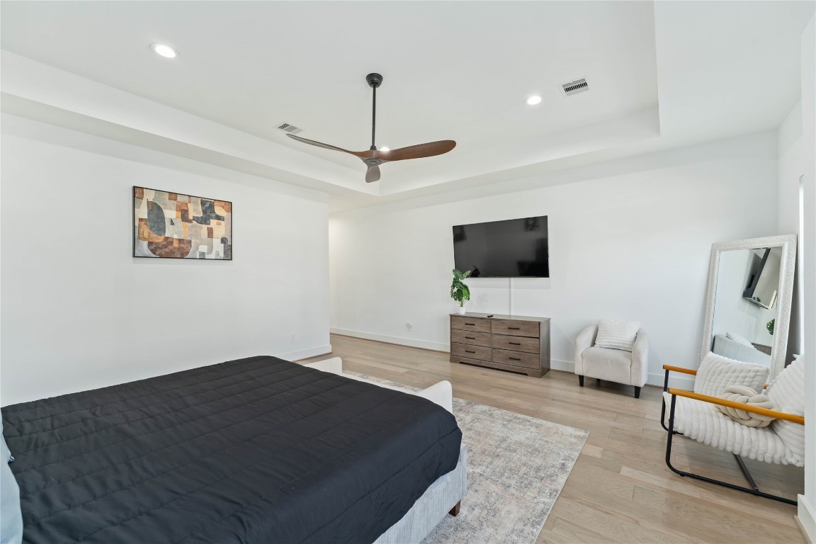 3034 Gray Street, Unit B Houston, TX 77004 - Photo 11 of 23 a bedroom with a bed and a flat screen tv