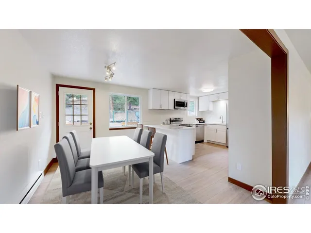 a kitchen with a table and chairs