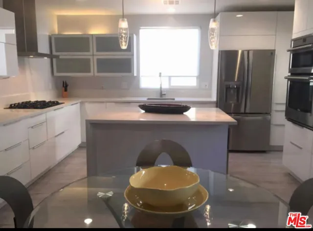 a kitchen with a sink and a stove